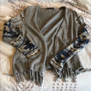 Grey sweater with fringe